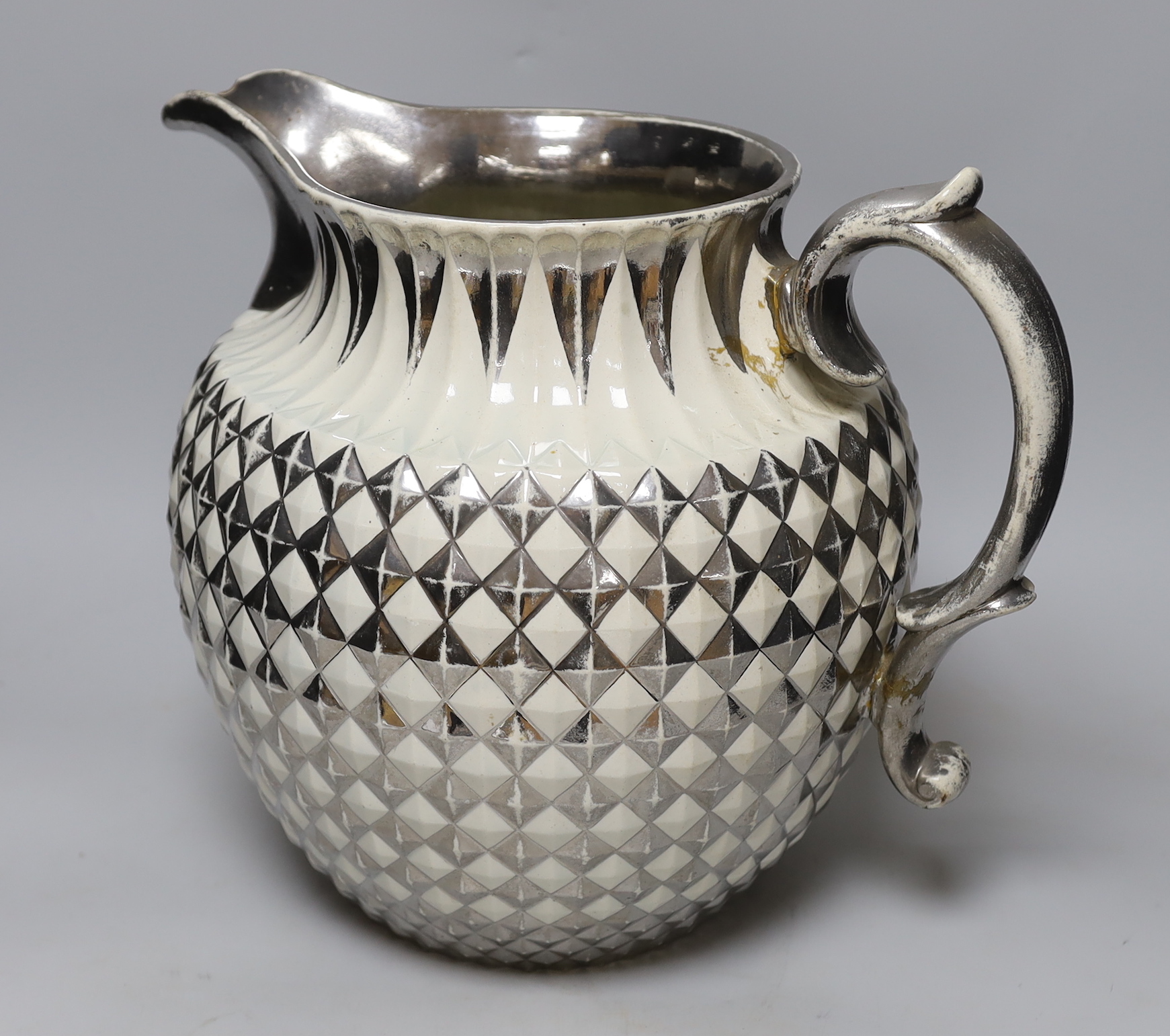 A massive early 19th century Staffordshire pineapple moulded silver lustre large jug, 33cm